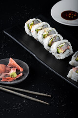 Raw fish sushi, shrimp, onion, avocado, lettuce and tiger's milk. vertical shot