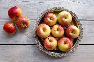 Fresh apples on the wooden background