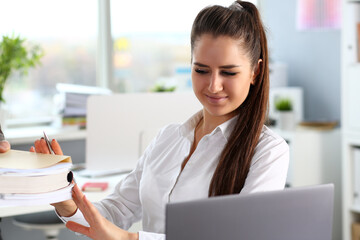 Male worker show pack of papers to busy beautiful female clerk in office portrait. hold in hand...