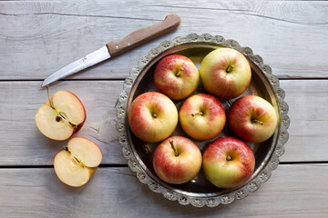 Fresh apples on the wooden background