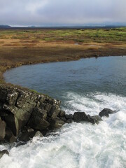 Drekkingarhylur (Drowning Pool), foaming waterfall in Þingvellir National Park, Iceland