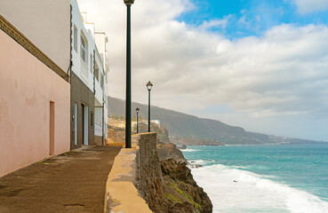 View on colorful buildings on the rock over the ocean in Punta Brava, Puerto de la Cruz, Tenerife, Canary Islands, Spain
