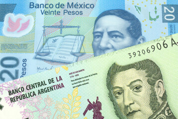 Fototapeta premium A five peso bill from Argentina, close up in macro with a blue twenty peso bank note from Mexico