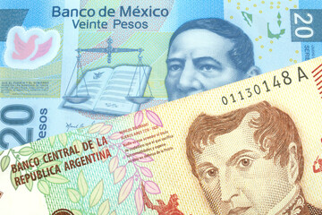 A ten peso bill from Argentina, close up in macro with a blue twenty peso bank note from Mexico