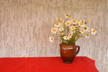 Bouquet of beautiful camomile in a vase. Summer bouquet