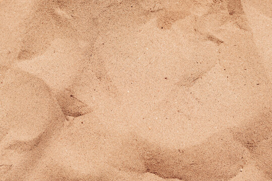 Texture of warm beach sand top view