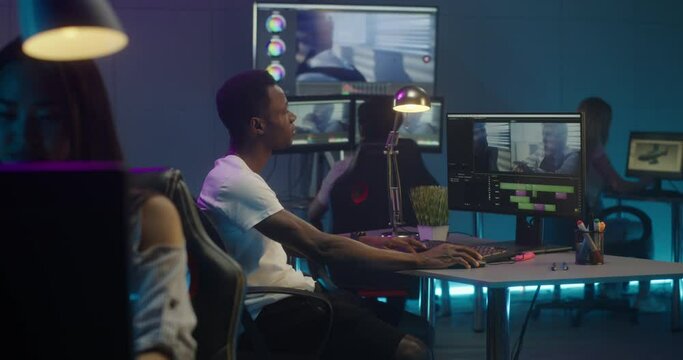 Video editors at work in editing room
