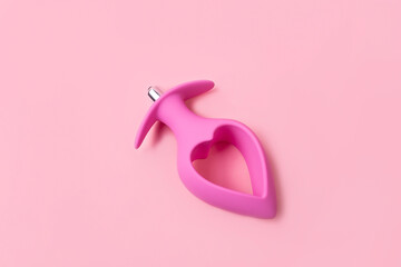 on a pink background sex product, toy for adults