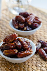 Fresh red dates (hurma) in bowl 