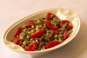 Boiled baked beans, nectarine, tomato, pepper, parsley and olive oil
