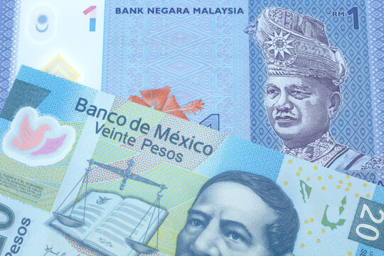 A blue, one ringgit Malaysian note close up in macro with a twenty peso note from Mexico