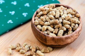 Bowl of white dried mulberries