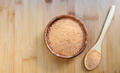 Turkish traditional tarhana (uncooked) and tomatoes on wooden background