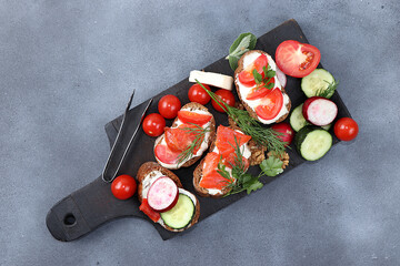 Detox Diet, Dietary Sandwiches with Cheese, Cucumber, Radish, Nuts and Red Fish, Healthy Breakfast with Ingredients. Healthy and Natural Food Concept, Lifestyle, Flat Lay, Space for Text