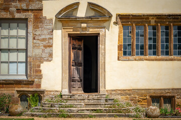 Fototapeta na wymiar old abandoned house stone building castle front door