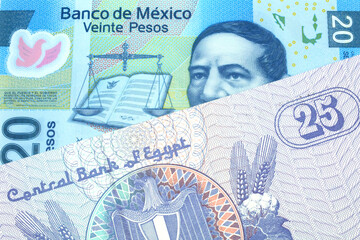 A close up image of a purple, twenty five Egyptian piastres note close up in macro with a blue, twenty Mexican peso note