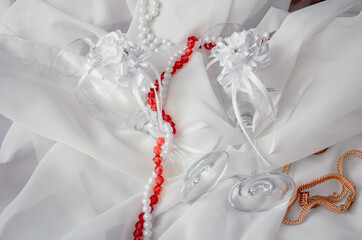 Wedding glasses with decorations on a white background