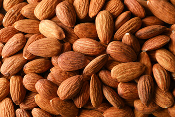 Tasty almond on whole background, close up. Vitamin food