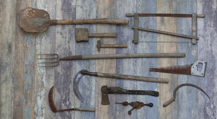 agricultural tools on old wooden background