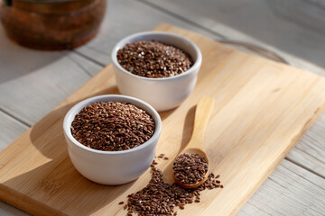 Siyez (siyazan) wheat bulgur in bowl and spoon on wooden background