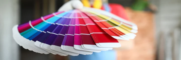 Fotobehang Builder holds out palette trendy colors for repair © megaflopp