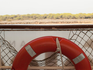 orange and red boat lifebuoy float on board
