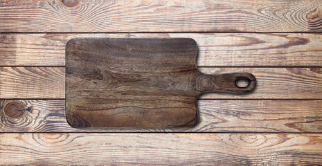 Empty vintage cutting board on planks.