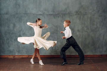 Young dancers boy and girl dancing in ballroom dance Samba