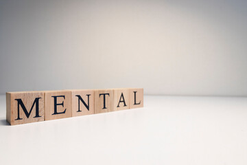 Mental health text from wooden cubes. Consept about health.