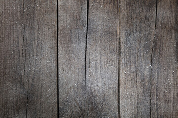 Background of three boards close-up. Texture and pattern of old boards covered in frost.