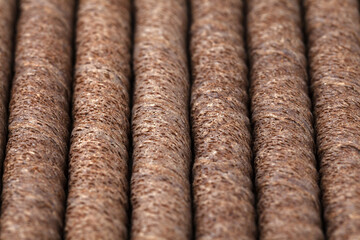 Tasty wafer roll sticks as background, top view. Crispy food. Close-up