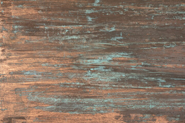 The texture of the copper background is covered with a blue and green patina.	
