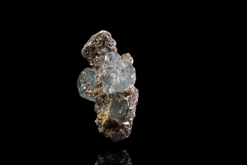 macro stone mineral aquamarine on a black background