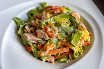 Salmon and Spinach Fettuccine pasta on white dish