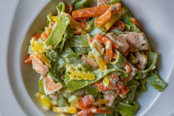 Salmon and Spinach Fettuccine pasta on white dish