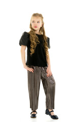 Cute little girl in a pantsuit. Isolated on a white background.