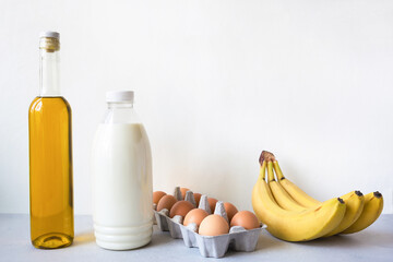 Set of fresh products milk, eggs, olive oil, bananas. Online purchase from a store. Ordering goods from the Internet. Food delivery. Close up, copy space picture.