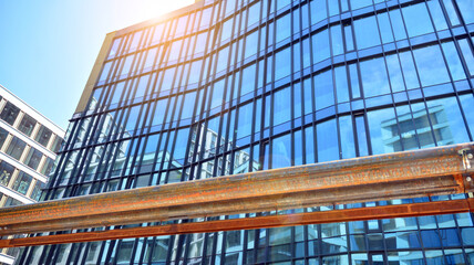 Facade texture of a glass mirrored office building. Fragment of the facade. Modern architecture of the office building.