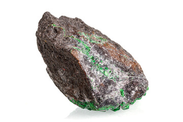 macro stone mineral uvarovite on a white background