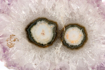 macro stone mineral eye amethyst on a white background