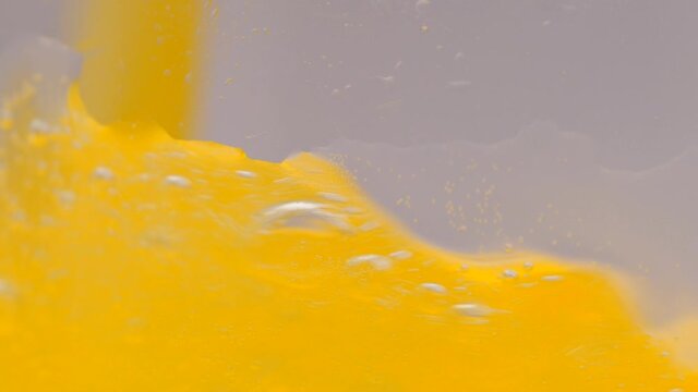 Orange Soda Drink Pouring Close Up In Slow Motion