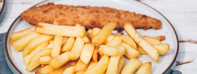 Traditional English Food such as Fish and Chips with green peas served in the Pub or Restaurant