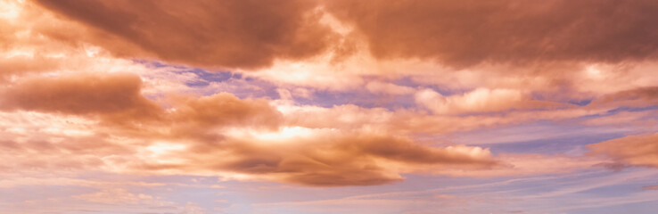 Summer sunset dranatic sky panorama with fleese clouds. Summer evening sky and weather concept background.