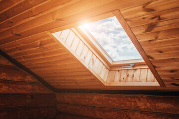 Plastic skylight - inside view - bright sunlight through the transparent glass into the house