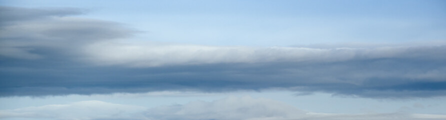 Fototapeta premium Clouds in the overcast sky view. Climate, environment and weather concept sky background.