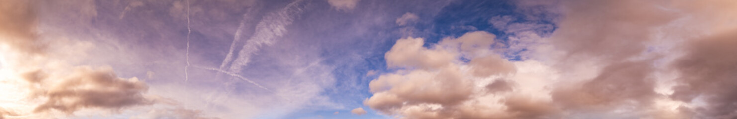 Obraz premium Summer sunset dranatic sky panorama with fleese clouds. Summer evening sky and weather concept high resolution background.