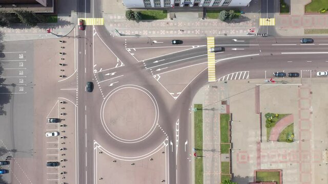 Top Aerial View Of Cityscape. Lenin Square, cars are moving in a circular motion. The historic center of Gomel. Road marking and car parking near the Gomel Park of the Rumyantsev-Paskevichs.
