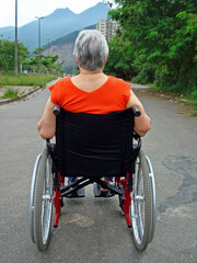 Obraz premium Disabled old woman on a wheelchair, Brazil