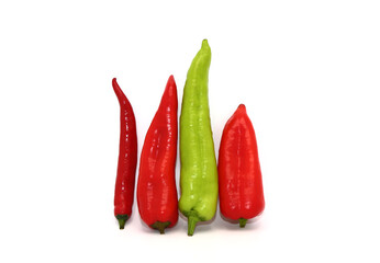 Composition of several types of sweet pepper of different shapes, colors and sizes on a light...
