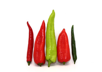 Composition of several types of sweet pepper of different shapes, colors and sizes on a light background. Natural product. Natural color. Close-up.